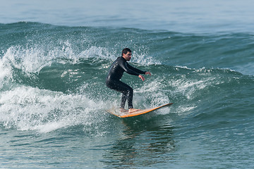 Image showing Surfing the waves