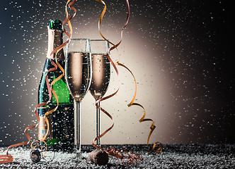 Image showing Bottle of champagne and filled glasses, festive composition with decoration
