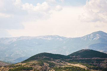 Image showing Beautiful uninhabited nature with hills and mountains in the distance