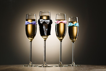 Image showing Glasses of champagne dressed in wedding suit and bow tie