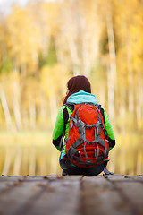 Image showing Long-haired brunette with backpack