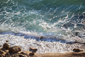 Image showing Beautiful sea landscape with crystal clear waves and coastal boulders