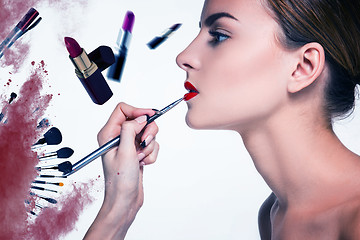 Image showing Beautiful female lips with make-up and brush