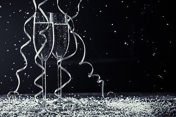 Image showing Black-and-white image of champagne glasses, ribbons, snowflakes