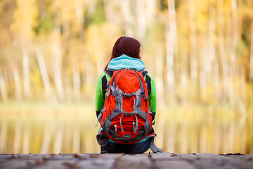 Image showing Long-haired brunette with backpack