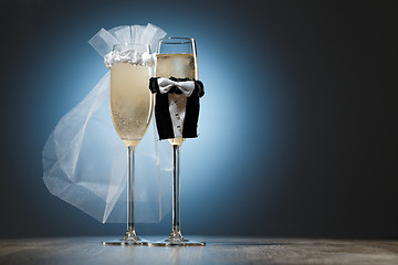 Image showing Two cooled glasses of champagne decorated for married couple