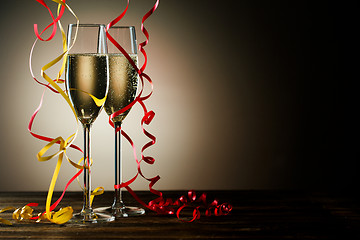 Image showing Two glasses with sparkling champagne and festive decoration