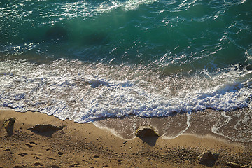 Image showing Transparent turquoise waves lapping on the sand