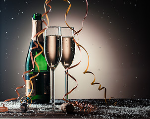 Image showing Festive composition with open bottle of champagne and filled glasses