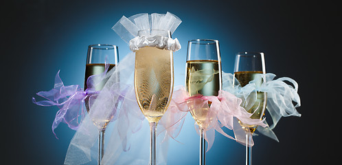 Image showing Elegant wedding glasses with champagne for bride and her bridesmaids