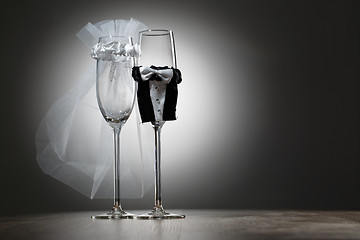 Image showing Two empty decorated champagne glasses for wedding party