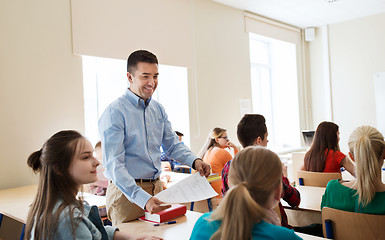 Image showing group of students and teacher with test results