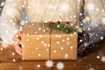 Image showing close up of woman with christmas gift or parcel