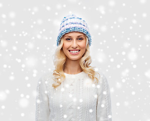 Image showing smiling young woman in winter hat and sweater
