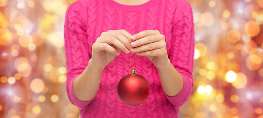 Image showing close up of woman in sweater with christmas ball