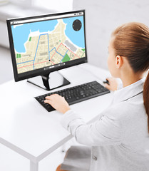 Image showing businesswoman with gps navigator map on computer