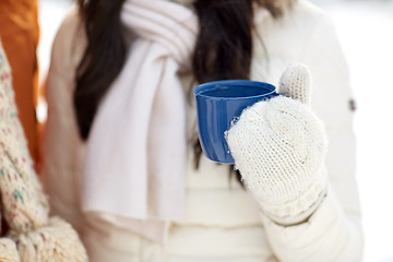 Image showing close up of woman holding hot tea cup