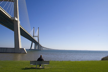 Image showing Lonely senior by the bridge