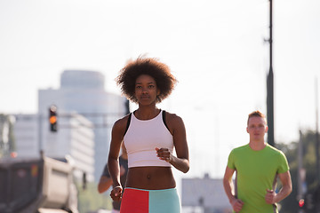 Image showing multiethnic group of people on the jogging