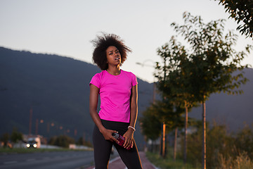 Image showing Portrait of a young african american woman running outdoors