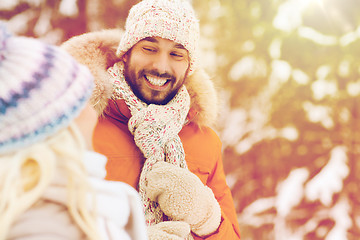 Image showing happy friends or couple in winter forest