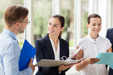 Image showing business team with folders meeting at office