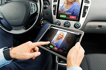 Image showing close up of man with tablet pc in car