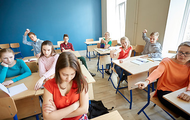 Image showing students gossiping behind classmate back at school