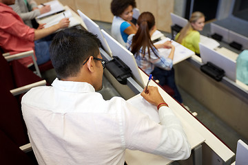 Image showing group of students with notebooks in lecture hall