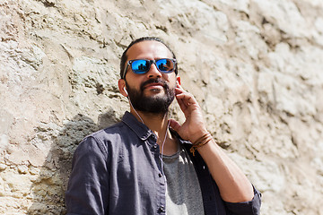 Image showing happy man with earphones listening to music