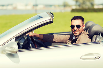 Image showing happy man driving cabriolet car outdoors