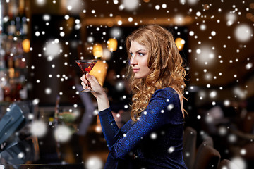 Image showing glamorous woman with cocktail at night club or bar