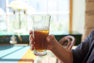 Image showing close up of man drinking beer at bar or pub