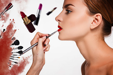 Image showing Beautiful female lips with make-up and brush