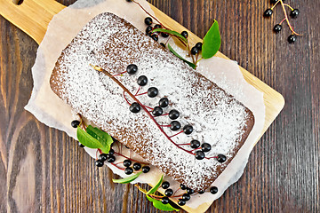 Image showing Fruitcake bird cherry on board top