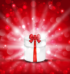 Image showing Round gift box on light red background with glow
