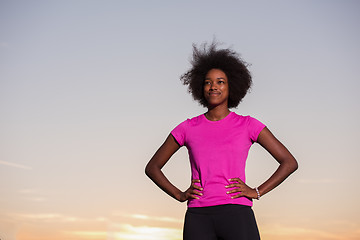 Image showing Portrait of a young african american woman running outdoors