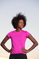 Image showing Portrait of a young african american woman running outdoors