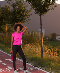 Image showing Portrait of a young african american woman running outdoors