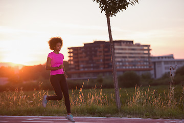 Image showing a young African American woman jogging outdoors