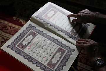 Image showing Muslim man reading the Koran in the Aladza painted mosque,Tetovo, Macedonia