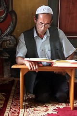 Image showing Muslim man reading the Koran in the Aladza painted mosque,Tetovo, Macedonia