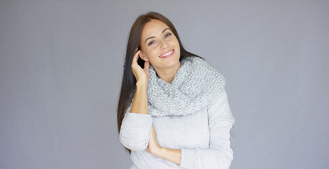 Image showing Gorgeous brunette woman posing isolated on gray background