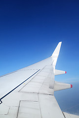 Image showing Wing of an airplane on blue sky