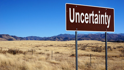 Image showing Uncertainty brown road sign