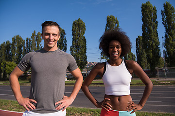 Image showing Portrait of romantic pretty couple on fitness session, outside t