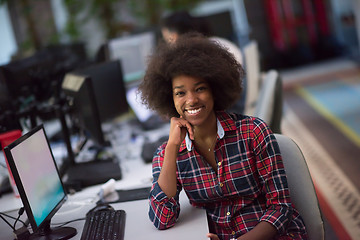 Image showing portrait of a young African American woman in modern office