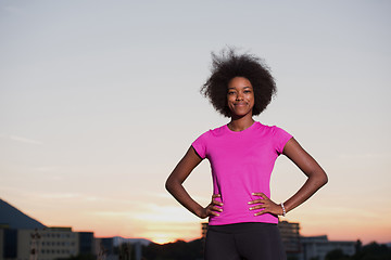 Image showing Portrait of a young african american woman running outdoors