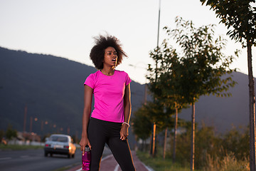 Image showing Portrait of a young african american woman running outdoors