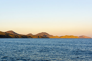 Image showing Mountainous coast at sunset light